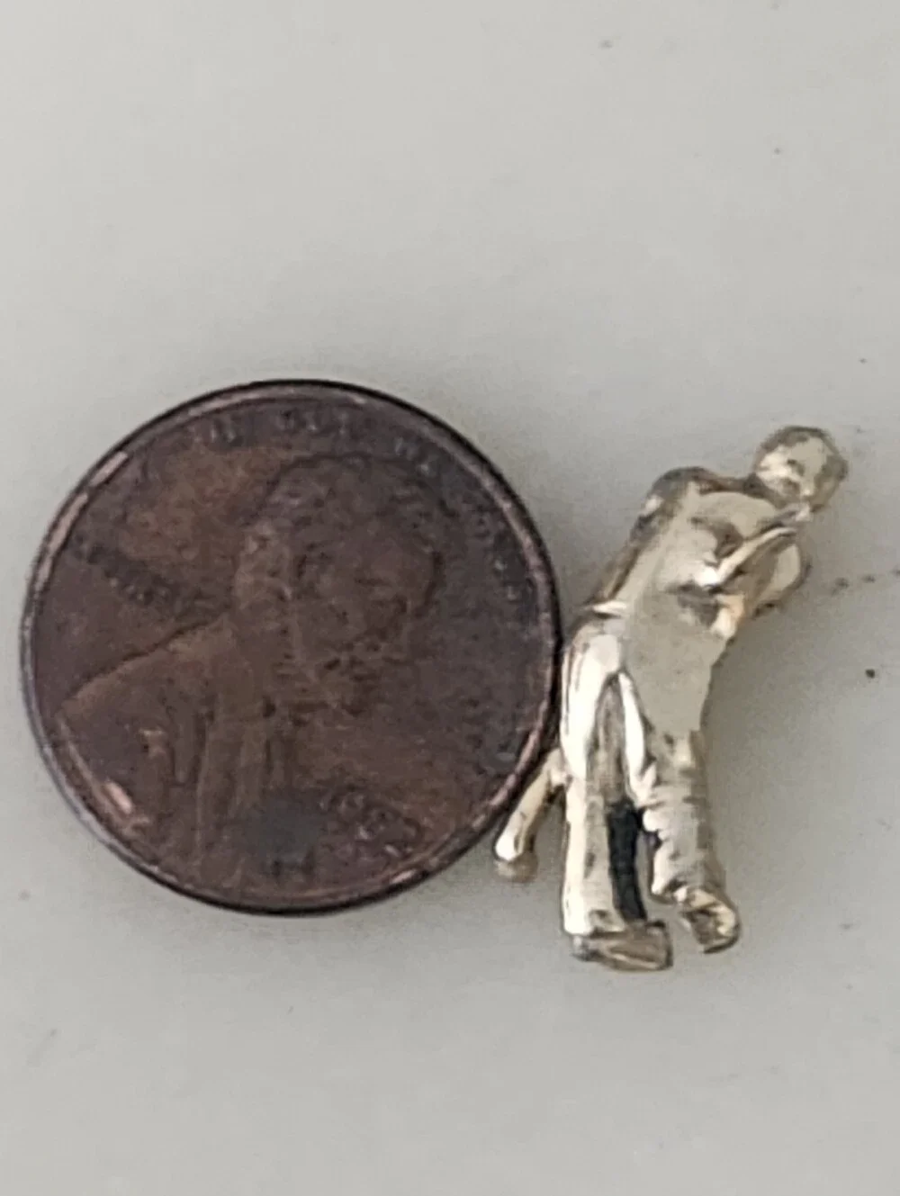 Gold-Tone Golfer Hitting Ball Figure Lapel Pin